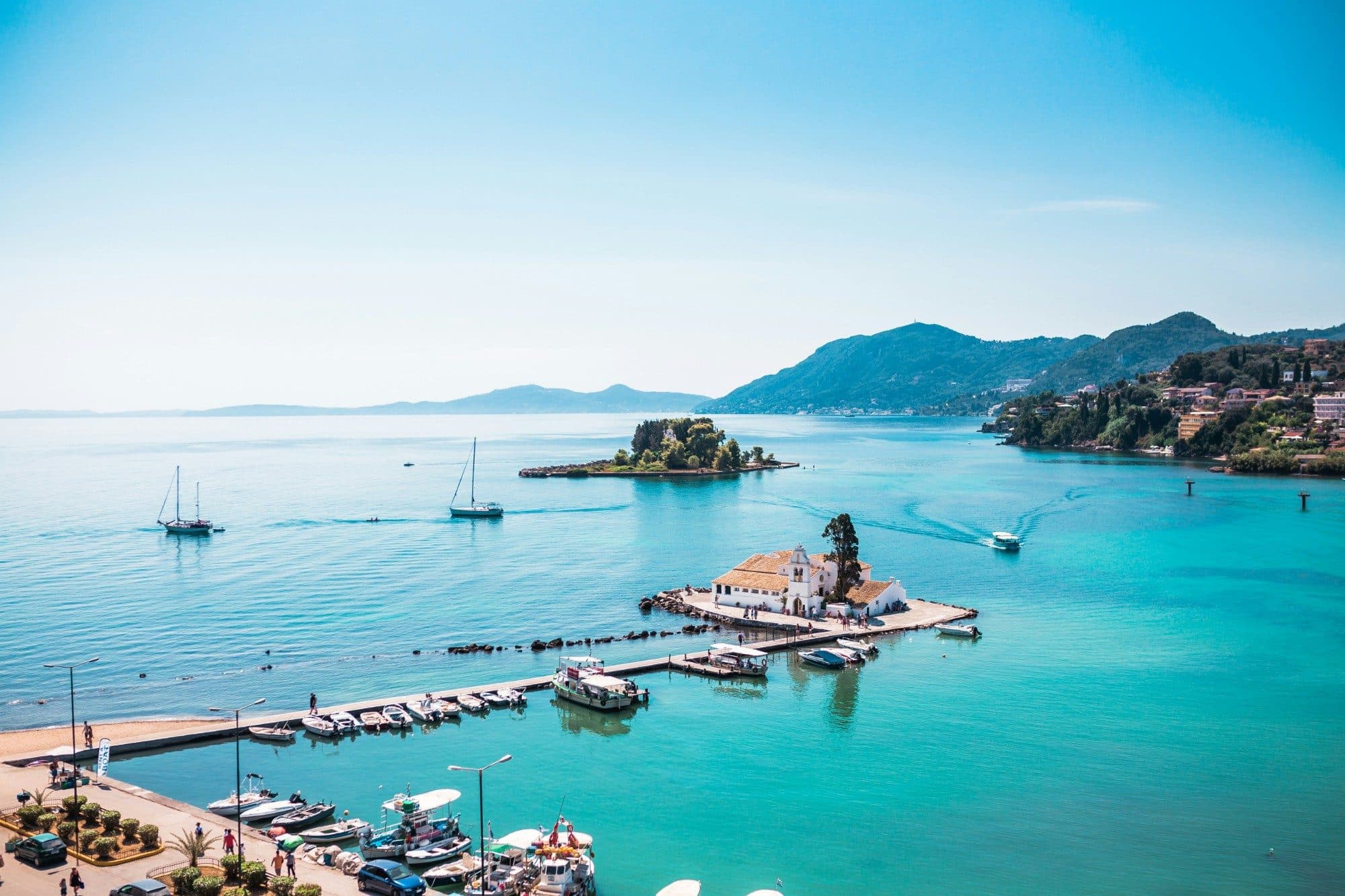 Vlacherna Monastery and Mouse Island in the turquoise bay at Kanoni, Corfu